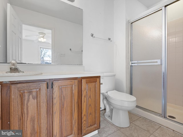 bathroom with vanity, ceiling fan, a shower stall, and toilet