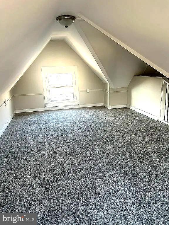 bonus room with vaulted ceiling