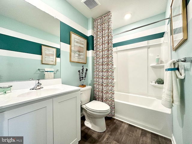 full bathroom featuring shower / tub combo with curtain, vanity, wood-type flooring, and toilet