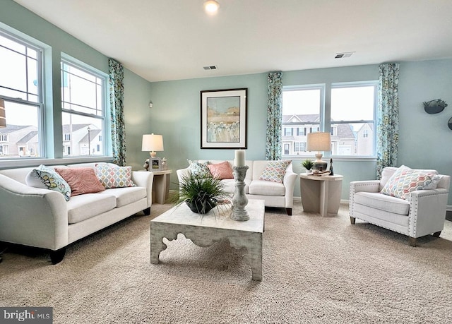 carpeted living room featuring a wealth of natural light