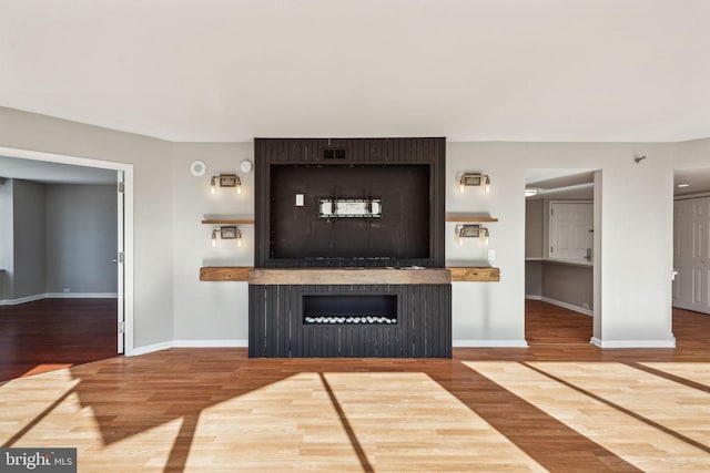 unfurnished living room featuring hardwood / wood-style floors