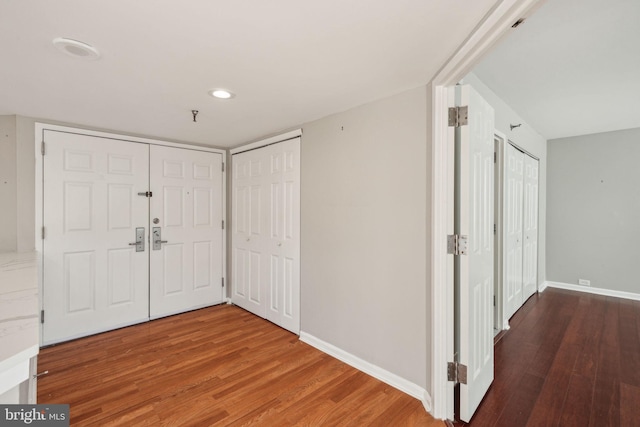 foyer featuring dark wood-type flooring