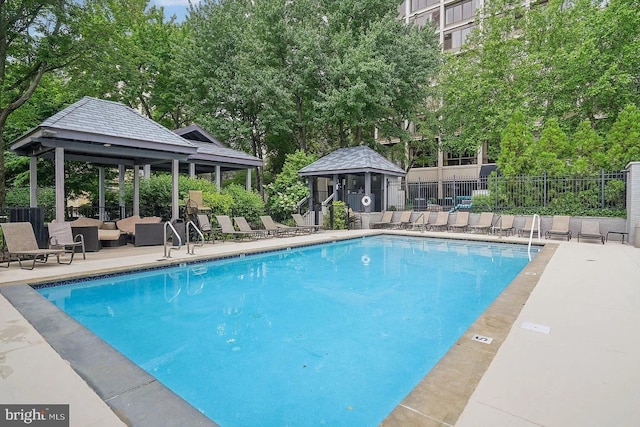 view of swimming pool with a gazebo and a patio