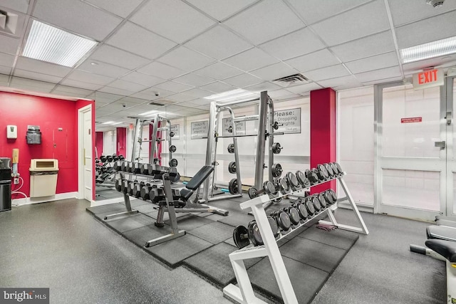 workout area with a drop ceiling