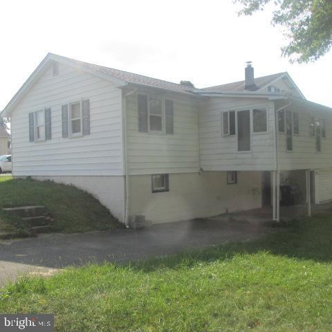 view of home's exterior featuring a yard