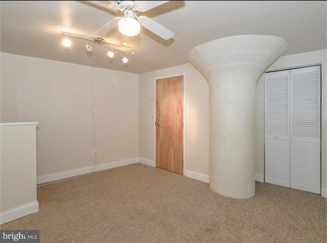 interior space featuring ceiling fan and carpet floors