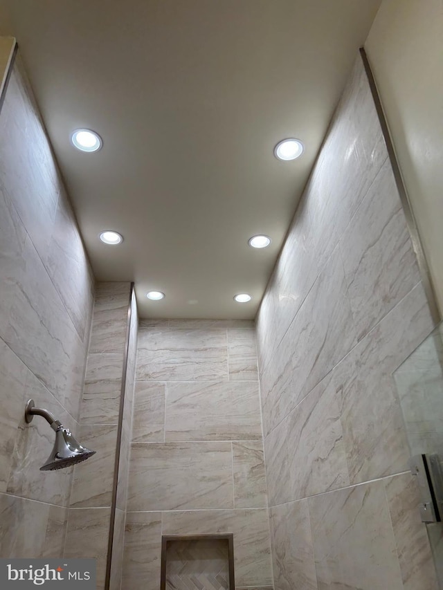 interior details featuring a shower