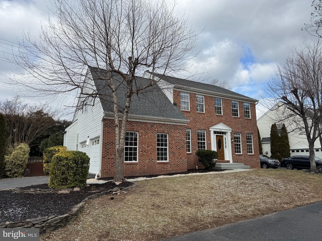 colonial house featuring a garage