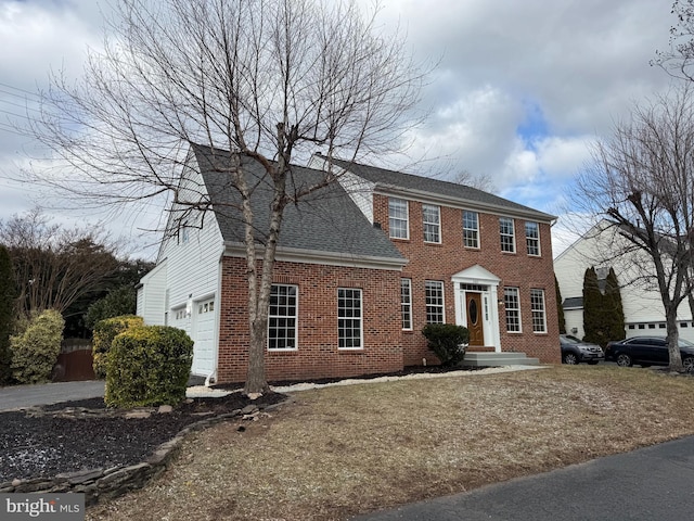 colonial house featuring a garage