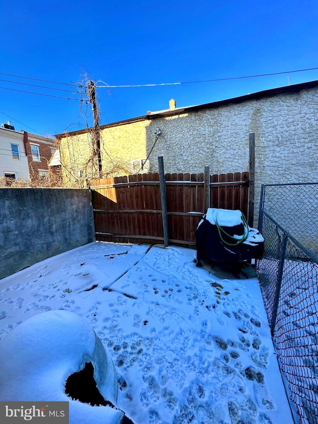 view of yard covered in snow