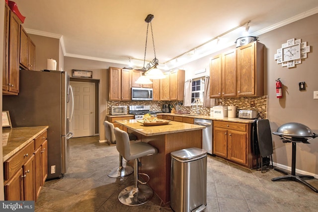 kitchen featuring decorative backsplash, decorative light fixtures, a center island, and stainless steel appliances