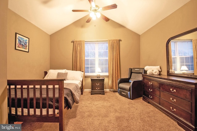 bedroom with ceiling fan, light carpet, and vaulted ceiling