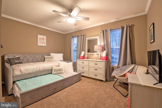 carpeted bedroom featuring ceiling fan and ornamental molding