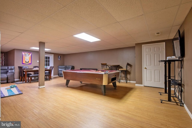 recreation room with a paneled ceiling, light hardwood / wood-style floors, and pool table