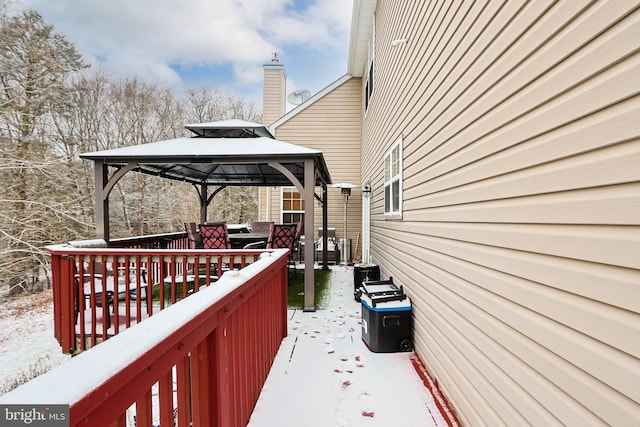 snow covered deck featuring a gazebo