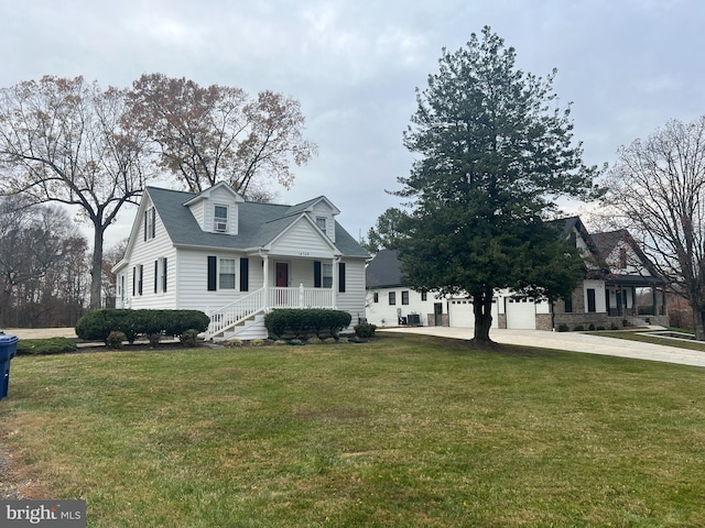 cape cod home featuring a front lawn