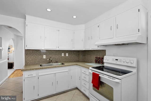 kitchen featuring white cabinetry, sink, white range with electric cooktop, light tile patterned floors, and custom exhaust hood