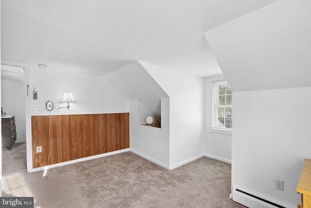 bonus room with carpet, lofted ceiling, and a baseboard radiator