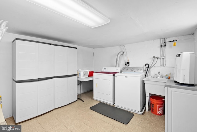 laundry area with independent washer and dryer