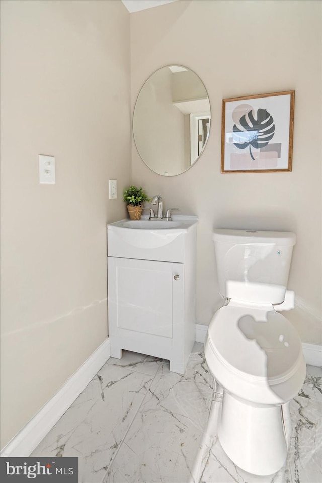 bathroom with toilet and vanity