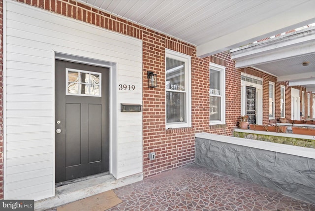 entrance to property with covered porch