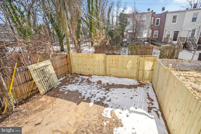 view of yard layered in snow