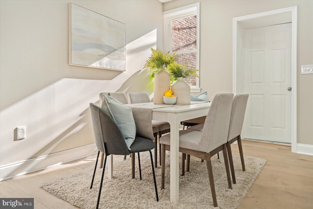 dining space featuring light hardwood / wood-style floors