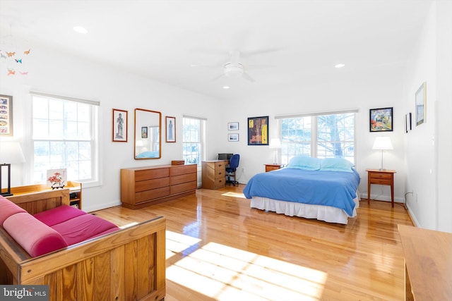 bedroom featuring light hardwood / wood-style flooring and ceiling fan