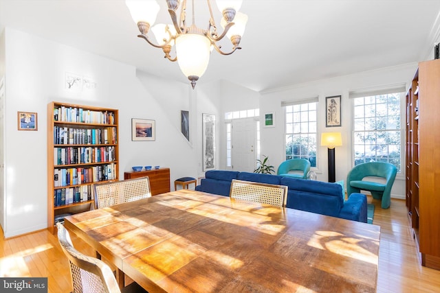 dining room featuring light hardwood / wood-style floors and a notable chandelier