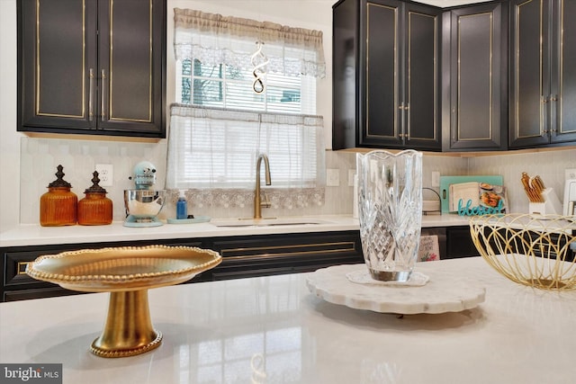 kitchen featuring backsplash and sink