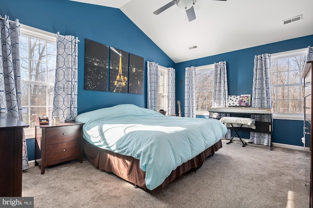 bedroom featuring ceiling fan, vaulted ceiling, and carpet