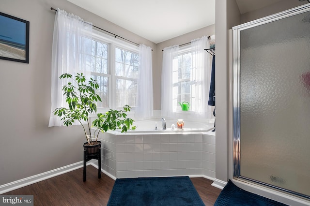 bathroom featuring a shower with door and hardwood / wood-style floors