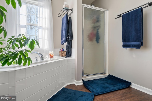 bathroom featuring independent shower and bath and wood-type flooring