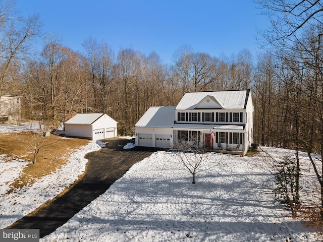 view of front property with a garage and an outdoor structure