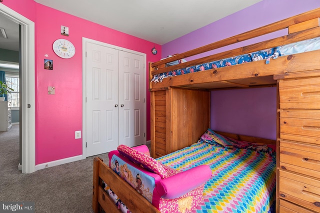 bedroom with a closet and carpet flooring