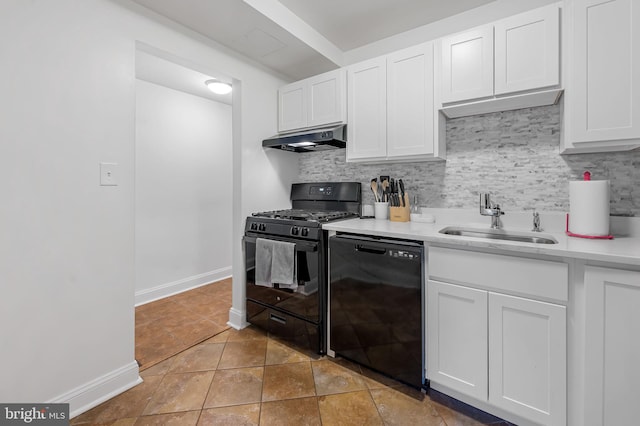 kitchen featuring decorative backsplash, white cabinetry, sink, and black appliances