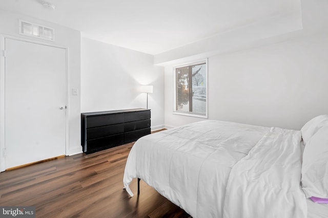 bedroom featuring dark wood-type flooring