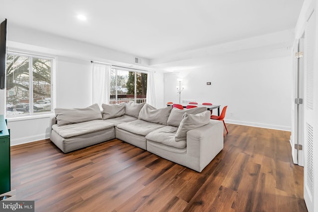 living room with dark hardwood / wood-style floors