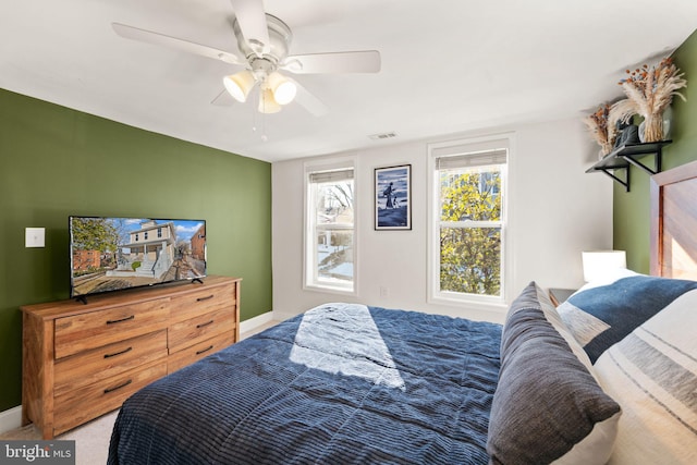 bedroom with ceiling fan and carpet