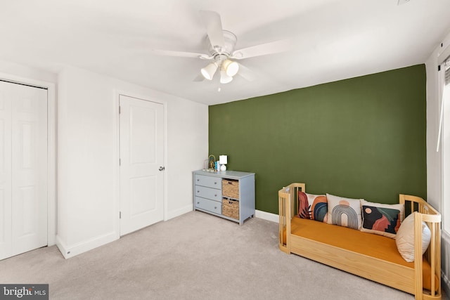 bedroom with ceiling fan and light colored carpet