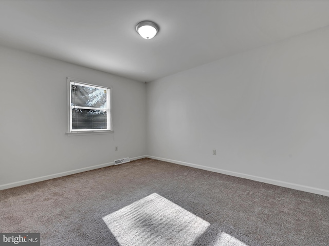 empty room featuring carpet flooring