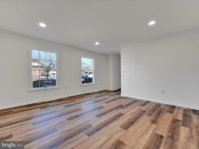 empty room featuring hardwood / wood-style flooring