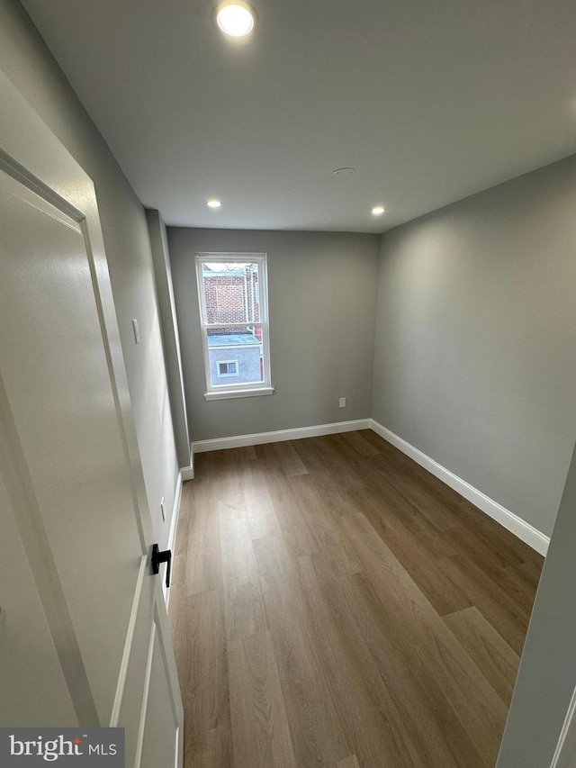 spare room featuring hardwood / wood-style flooring