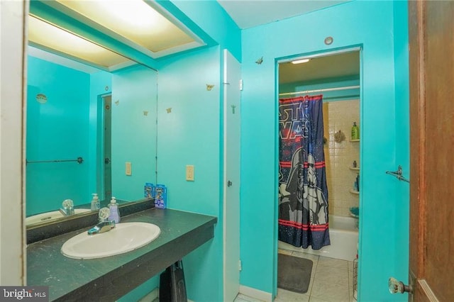 bathroom with tile patterned floors, sink, and shower / tub combo