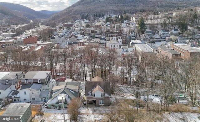 snowy aerial view featuring a mountain view