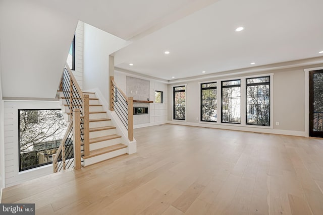 unfurnished living room with light hardwood / wood-style flooring