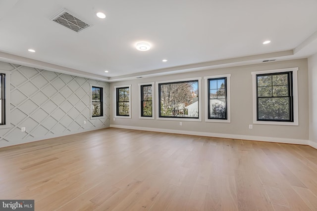 spare room with light hardwood / wood-style flooring