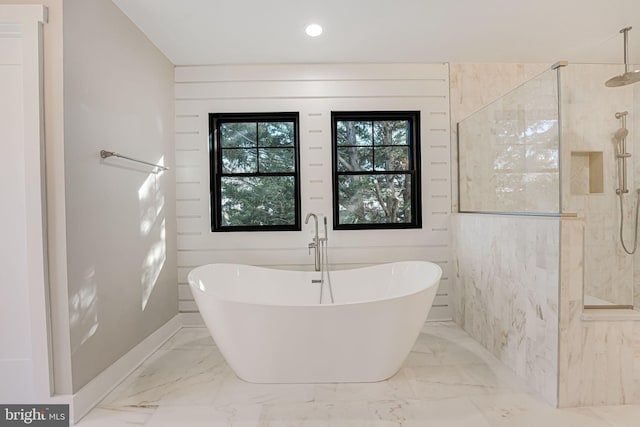 bathroom with separate shower and tub
