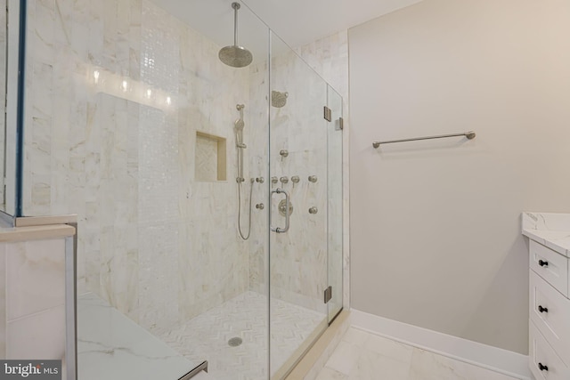 bathroom with vanity and a shower with shower door