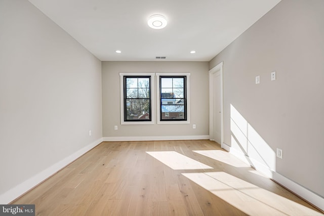 unfurnished room featuring light hardwood / wood-style flooring